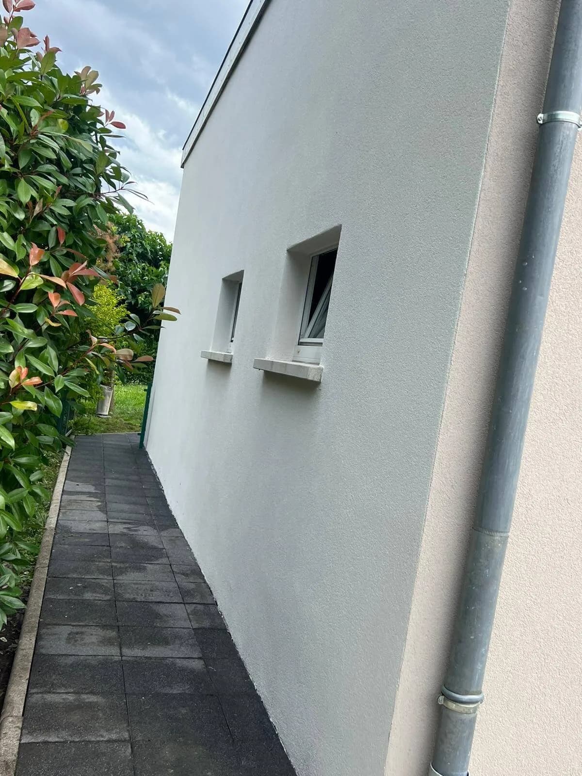 Mur pignon enduit, finition lisse